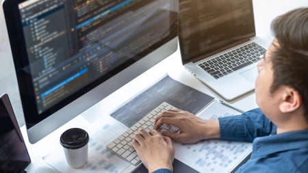 Professional Development programmer working in programming website a software and coding technology, writing codes and data code, Programming with HTML, PHP and javascript.の写真素材