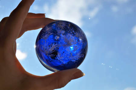 Decorative ball in hand with colorsの写真素材