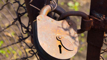 Retro castle of old iron, closes the gate, with a slit for keyの写真素材