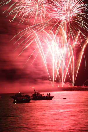 Fireworks exploding in a dark skyの写真素材