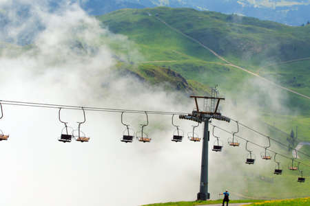 Chairlifts in mountain fogの写真素材