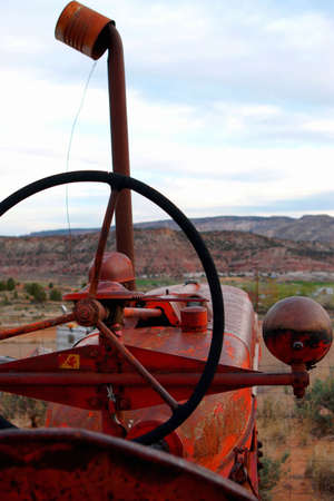 Driver's view from old red tractor in rural town.の写真素材
