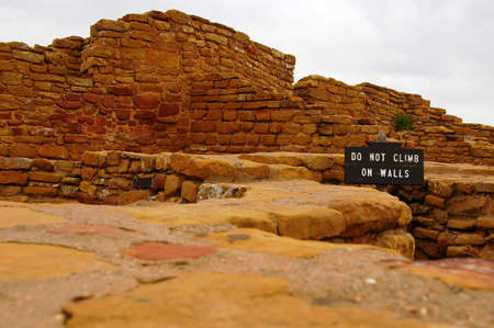 Sign on pueblo ruin that forbids climbing.の写真素材