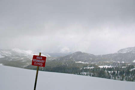 Red boundary sign at a ski resort.の写真素材