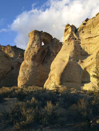 A white sandstone formation with a small arch.の写真素材