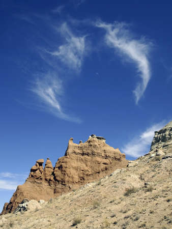 A swirl of clouds over a desert formation の写真素材