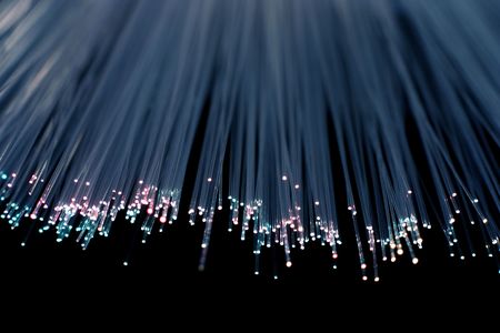 Strands of fiber light in blue and purpleの写真素材