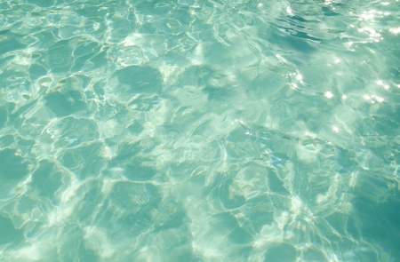 Sparkling pool water in sunny day