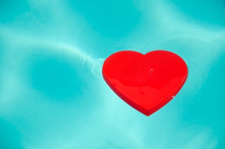 Heart shape in swimming pool - holiday concept