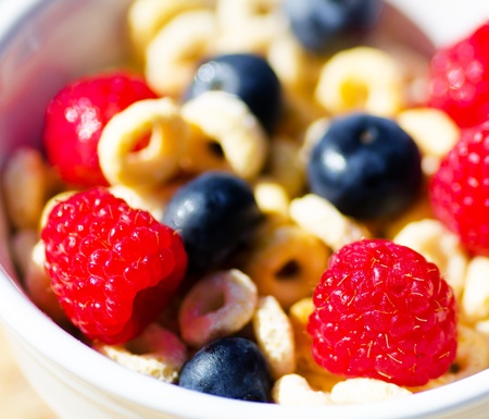 Healthy breakfast with cereals, blueberry, raspberry. Selective focus.の写真素材