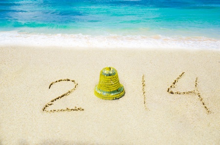 Number 2014 with christmas decoration on the sandy beach - holiday conceptの写真素材