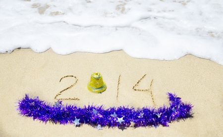 Number 2014 with christmas decorations on the sandy beach - holiday conceptの写真素材