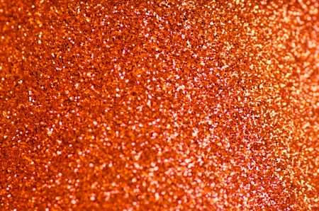 Christmas orange glitter texture with selective focusの写真素材