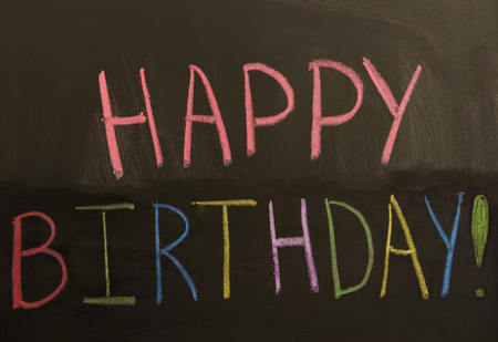Sign "Happy birthday" on the blackboard - holiday conceptの写真素材