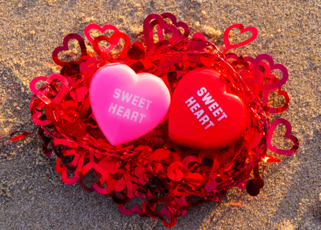 Two hearts on the sandy beach in a nestの写真素材