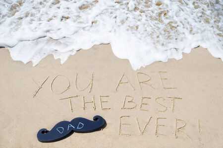 Sign "You are the best dad ever" on the sandy beach - Happy father's day backgroundの写真素材