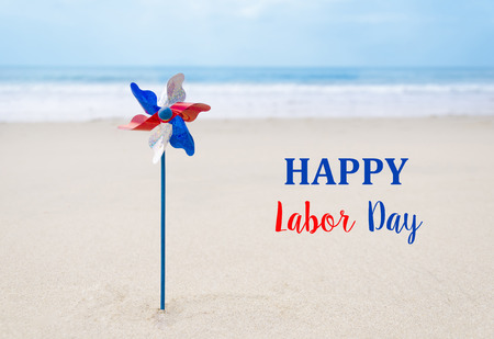 Labor Day USA background with decoration on the sandy beachの写真素材