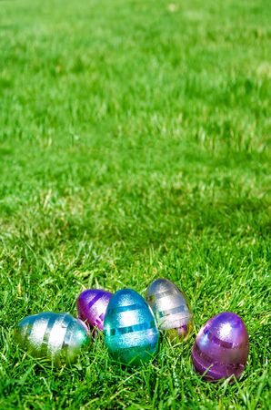 Easter Colorful eggs on the green grass background