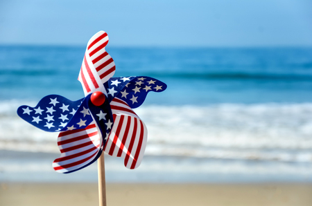Patriotic USA background with decorations on the sandy beachの写真素材