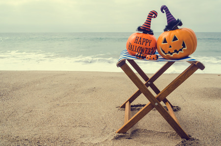 Beach and Ocean Happy Halloween background with pumpkin in the witch's hats - vintage toneの写真素材