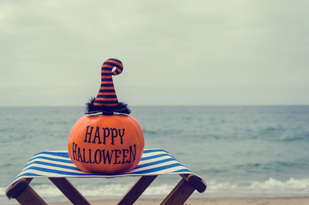 Beach and Ocean Happy Halloween background with pumpkin in the witch's hats - vintage toneの写真素材
