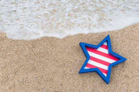 Patriotic USA background with decorations on the sandy beachの写真素材
