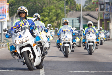 Kota Bharu, Kelantan - March 1, 2013 ; A group of Royal Malaysian Police escorting Le tour de Langkawi cycling event in Kota Bharu.のeditorial素材