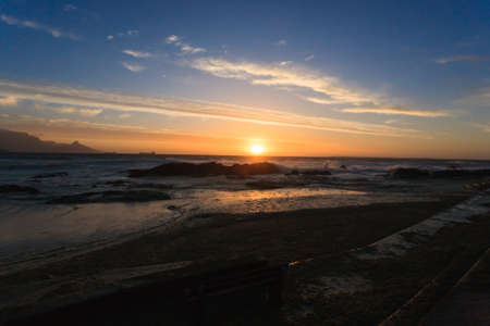 A landscape of the ocean at sunshine from Cape Townの写真素材
