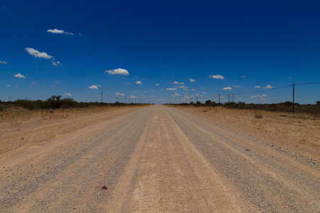 Dirt road out of Mata Mata gate to Kalahari desertの写真素材