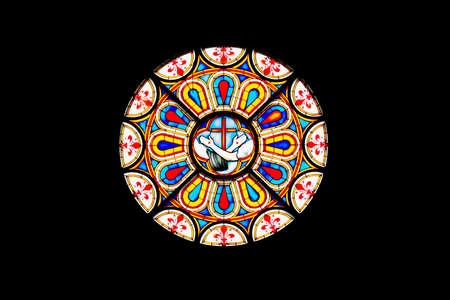 Close up of a colored rose window from a Florence church, Italy