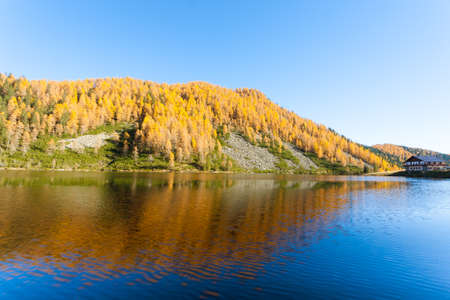 Mountain panorama from Italian Alps. Reflections on water from "Calaita" lake. Beautiful dolomitesの写真素材