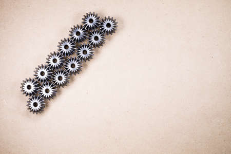 Mechanical components on wodden background. Gears, industrial objectsの写真素材