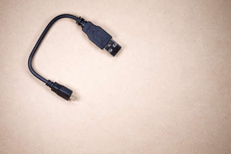 Usb plug isolated over wodden backgroundの写真素材