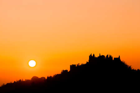 Castle silhouette at sundown. Italian panorama from "Marostica". Orange skyのeditorial素材
