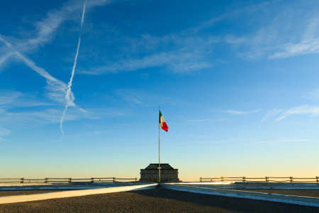 Italian flag on blue sky from first world war memorial in "Monte Grappa", Italy. Italian Alps. Architectureのeditorial素材