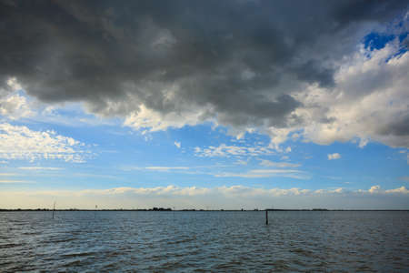 Sunset over water from "Delta del Po", Italian landscape. water and skyの写真素材