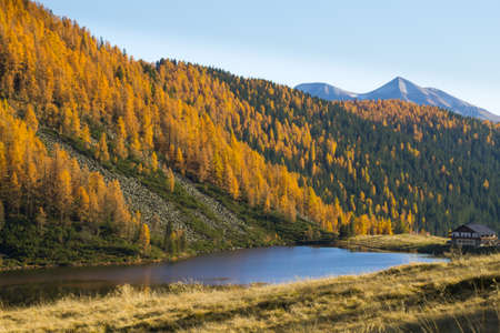 Mountain panorama from Italian Alps. Reflections on water from "Calaita" lake. Beautiful dolomitesの写真素材