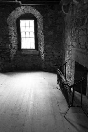 Interior design, old fireplace inside medieval castle lounge. Image digitally alteredのeditorial素材