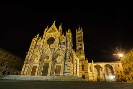 Night view of Siena Cathedral Santa Maria Assunta (Duomo di Siena) in Siena, Tuscany, italy.  Italian landmarkの写真素材