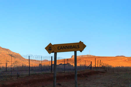 Cannibals road sign on the road to Drakensberg mountains, South Africa.の写真素材