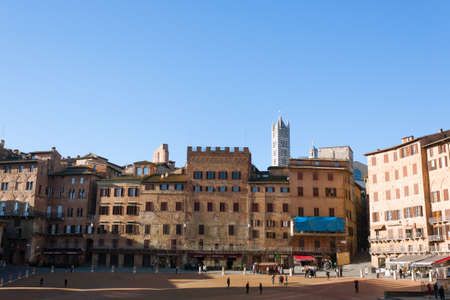 Day view of Campo Square (Piazza del Campo), Siena Palazzo Pubblico and Mangia Tower (Torre del Mangia) in Siena, Tuscany, Italy.のeditorial素材