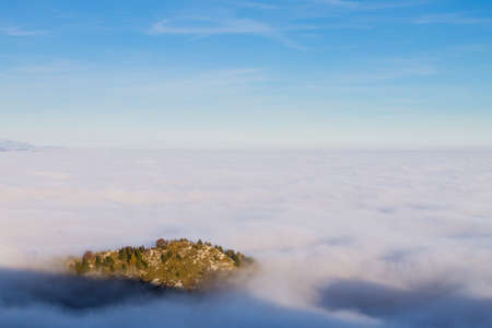 Panorama from Italian alps, carpet of clouds and peaks. Top mountain landscapeの写真素材