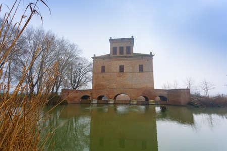 Ancient building from Po river lagoon. Po Delta wetlands landmark. Italian travel destinationの写真素材