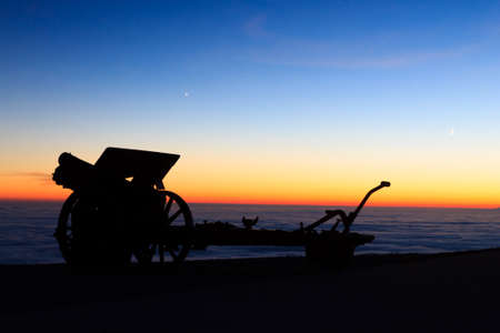 Cannon silhouette at twilight. Night landscape from Italian Alps.の写真素材