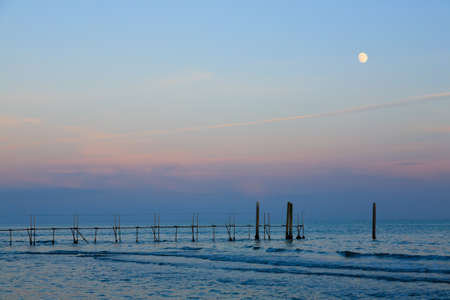 Beach landscape at dawn with moon. Jesolo beach view, Italian panoramaの写真素材