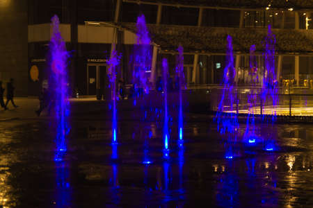 MILAN, ITALY-OCTOBER 30, 2016: Financial district night view. Illuminated water fountains. Modern skyscrapers in Gae Aulenti square. Unicredit bank towerのeditorial素材