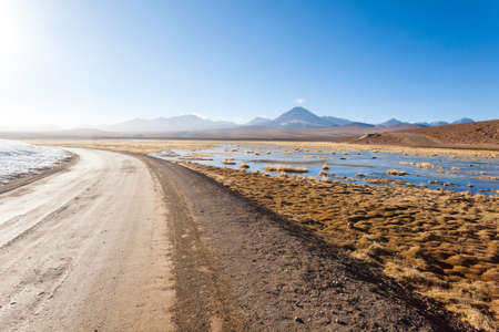 Chilean landscape, dirt road and Licancabur volcano. Chile panoramaの写真素材