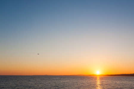 Nice beach day landscape, France.  Nice beach and famous Walkway of the English, Promenade des Anglais. Famous French touristic townの写真素材