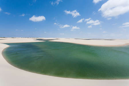 White sand dunes panorama from Lencois Maranhenses National Park, Brazil. Rainwater lagoon. Brazilian landscapeの写真素材