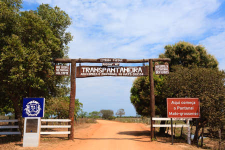 Pantanal entrance gate along Transpantaneira dirt road. Brazilian landmark. Road in perpectiveの写真素材